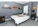 Bedroom with collegiate decor and a bed with an orange state logo at 179 Hillcrest Dr, Oviedo, FL 32765