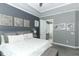Inviting main bedroom with a tray ceiling, soft carpeting, and ensuite bath at 179 Hillcrest Dr, Oviedo, FL 32765