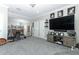 Spacious bonus room with ceiling fan, TV, and neutral carpet at 179 Hillcrest Dr, Oviedo, FL 32765