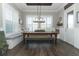 The dining area features a wooden table with bench seating, modern light fixture, and bright windows at 179 Hillcrest Dr, Oviedo, FL 32765