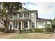 Beautiful two-story home with a well-manicured lawn, inviting front porch, and charming architectural details at 179 Hillcrest Dr, Oviedo, FL 32765