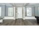 Welcoming foyer featuring hardwood floors, stylish seating, and abundant natural light at 179 Hillcrest Dr, Oviedo, FL 32765
