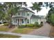 Beautiful two-story home boasting a classic porch, well-kept lawn, and mature trees at 179 Hillcrest Dr, Oviedo, FL 32765