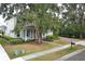 Lovely two-story home with a welcoming front porch and lush front lawn at 179 Hillcrest Dr, Oviedo, FL 32765