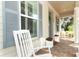Welcoming front porch showcasing comfortable rocking chairs and lovely decorative accents at 179 Hillcrest Dr, Oviedo, FL 32765