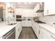 Bright kitchen with white cabinets, stainless steel appliances, and sleek countertops at 179 Hillcrest Dr, Oviedo, FL 32765