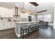 Spacious kitchen with white cabinetry, stainless appliances, and a large center island with seating at 179 Hillcrest Dr, Oviedo, FL 32765