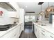 Stylish kitchen with white cabinetry, stainless steel appliances, and a spacious layout at 179 Hillcrest Dr, Oviedo, FL 32765