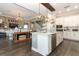 Open-concept kitchen featuring a large island, modern appliances, and seamless flow to the living area at 179 Hillcrest Dr, Oviedo, FL 32765
