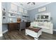 Comfortable living room featuring hardwood floors, a rustic coffee table, and a cozy white sofa at 179 Hillcrest Dr, Oviedo, FL 32765