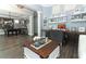 Inviting living room with a rustic coffee table and a view into the game room at 179 Hillcrest Dr, Oviedo, FL 32765