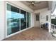 Covered brick patio with sliding glass doors leading to the pool at 179 Hillcrest Dr, Oviedo, FL 32765