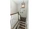 Detailed view of the stairway with wood and white accents and a rustic wooden gate at 179 Hillcrest Dr, Oviedo, FL 32765