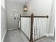 Detailed view of the carpeted stairway with wood and white accents and a lantern style light fixture at 179 Hillcrest Dr, Oviedo, FL 32765