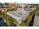 Aerial view of a modern apartment building with parking and city views at 202 E South St # 1048, Orlando, FL 32801