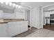Bathroom with granite countertop, white cabinets, and tiled floor at 202 E South St # 1048, Orlando, FL 32801
