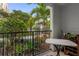 Private patio with small table and chairs, overlooking a landscaped courtyard at 202 E South St # 1048, Orlando, FL 32801
