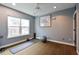 Bright yoga room with a large window, yoga mat, and exercise ball for a peaceful workout session at 202 E South St # 1048, Orlando, FL 32801