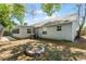 Large backyard with fire pit and mature trees at 2031 Eaton St, Maitland, FL 32751