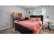 Bedroom with coral bedding, a TV, and gray walls at 2031 Eaton St, Maitland, FL 32751