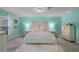 Spacious bedroom with light teal walls, a large bed, and a dresser at 2031 Eaton St, Maitland, FL 32751