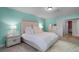 Bright bedroom with light teal walls and a large bed at 2031 Eaton St, Maitland, FL 32751