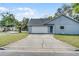 House exterior with driveway and garage at 2031 Eaton St, Maitland, FL 32751