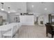 Open concept kitchen with white cabinets and island at 2031 Eaton St, Maitland, FL 32751