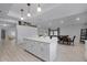 Modern kitchen with island, white cabinets and quartz countertops at 2031 Eaton St, Maitland, FL 32751
