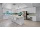 Modern kitchen featuring white cabinets, quartz countertops, and stainless steel appliances at 2031 Eaton St, Maitland, FL 32751