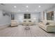 Open living area with light walls, plush seating, and a large picture window at 2031 Eaton St, Maitland, FL 32751