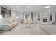 Spacious living room with light flooring, a fireplace, and comfy furniture at 2031 Eaton St, Maitland, FL 32751