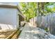 Side yard with walkway, landscaping, and wooden fence at 2031 Eaton St, Maitland, FL 32751