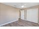 This bedroom features wood-look floors, a ceiling fan and sliding closet doors at 21 Juniper Loop Cir, Ocala, FL 34480