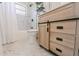 Updated bathroom with a modern vanity and marble tile at 2414 Herbison Dr, Orlando, FL 32810