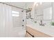 Updated bathroom features a subway tile shower, new vanity, and stylish fixtures at 2414 Herbison Dr, Orlando, FL 32810