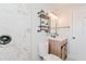 Bright bathroom with a marble shower and contemporary vanity at 2414 Herbison Dr, Orlando, FL 32810