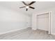 Simple bedroom featuring a ceiling fan, a large closet, and light gray walls at 2414 Herbison Dr, Orlando, FL 32810