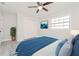 Cozy bedroom with ceiling fan, ample closet space, and blue bedding at 2414 Herbison Dr, Orlando, FL 32810