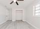Bright bedroom with ceiling fan, large closet, and light gray walls at 2414 Herbison Dr, Orlando, FL 32810