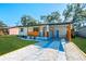 Recently updated home showcasing a stylish exterior and attractive landscaping at 2414 Herbison Dr, Orlando, FL 32810