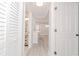 Clean hallway with light gray walls and vinyl plank flooring at 2414 Herbison Dr, Orlando, FL 32810