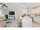 Open concept kitchen and living area with island and modern finishes at 2414 Herbison Dr, Orlando, FL 32810