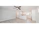 Open concept kitchen with white cabinets and vinyl flooring at 2414 Herbison Dr, Orlando, FL 32810