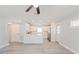Modern white kitchen with stainless steel appliances and quartz countertops at 2414 Herbison Dr, Orlando, FL 32810