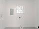 Bright laundry room with window and electrical panel at 2414 Herbison Dr, Orlando, FL 32810