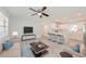 Open concept living room with modern kitchen and light flooring at 2414 Herbison Dr, Orlando, FL 32810