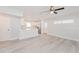 Spacious living area with open concept design and wood-look flooring at 2414 Herbison Dr, Orlando, FL 32810
