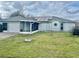 House exterior with solar panels and screened porch at 247 Cranbrook Dr, Kissimmee, FL 34758