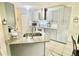 Modern kitchen with gray cabinets and granite countertops at 247 Cranbrook Dr, Kissimmee, FL 34758